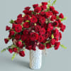 Red rose bouquet in a white textured vase