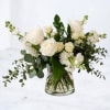 Poise is a refined white floral arrangement designed with natural movement and