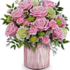 Stunning pink roses and carnations accented with lime green carnations in a