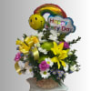 Basket arrangement of mixed flowers with rainbow and smiley balloons