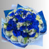 Bouquet of blue and white roses with small white flowers wrapped in blue paper