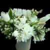 White tulips and chrysanthemums arranged in a vase