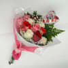 Bouquet of pink, red, and white roses with a heart balloon