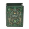 Green witch spell book-shaped ceramic container with decorative botanical artwork