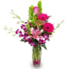 Pink and purple mixed bouquet in a clear glass vase