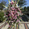 This is a large standing spray with purple lavender and white colored