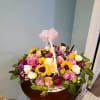 Our largest floral gift basket. full of an assortment of colorful blooms.
