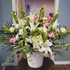 Beautiful lush sympathy floral basket. Our largest floor display.