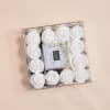 Square box of white roses with a clear jeweled center