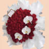 Red rose bouquet with white orchid blooms and white wrapping