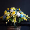 A beautiful artificial spring flower cemetery saddle in honor of a lost