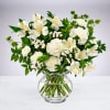 White flowers arranged in a clear glass vase