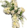 White rose and orchid cross arrangement with green leaves