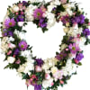 Heart-shaped floral wreath with white, pink, and purple flowers