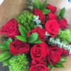 Bouquet of red roses with green filler and brown wrapping