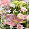 Pastel mixed bouquet with pink lilies, roses, and white daisies