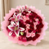 Bouquet of red and pink roses with white-pink lilies in pink wrap