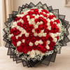 Large bouquet of red and white roses with black wrapping