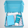 Blue gift box with perfume, pillow mist, and lotion