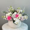 Medium size ceramic pumpkin filled with fresh flowers.