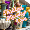 Colorful decorative vases arranged on a shelf with "Thrifted Nursery Vase" text overlay