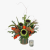 Sunflower arrangement in a vase with orange accents and a candle