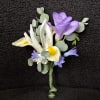 Whispering Garden Boutonni&egrave;re is a refined floral accent designed to complement a