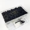 Black roses in a clear acrylic gift box with a drawer and ribbon