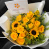 Yellow roses and sunflowers in white wrapping