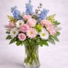  Description: A soft and airy arrangement featuring blush pink roses, delicate