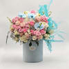 Pink and white rose bouquet in a pale blue box with blue accents
