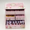 Pink floral gift box with drawers of wrapped chocolates