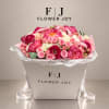Pink and white mixed flower bouquet in a white gift box