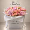 Pink and peach roses with lavender hydrangeas in a white gift box
