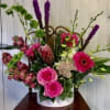 Hot pink roses and gerbera daisies take center stage in this Pretty