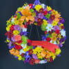 Vibrant and full just like the life they lived. This wreath is
