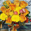 Bouquet of yellow and orange roses with bright yellow mums