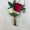 Red and white rose boutonniere with small white filler flowers