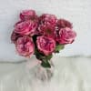 Pink rose bouquet with chrysanthemum blooms tied with a sheer ribbon