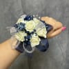White spray roses with navy blue fillers with pearl bracelet