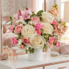 Pink and ivory rose bouquet in a white vase