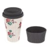 Floral-patterned takeaway coffee cup with a black lid and sleeve