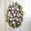 Standing floral spray with white, pink, and purple flowers