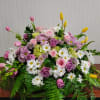 Large mixed bouquet of pink and purple roses with white daisies and yellow tulips
