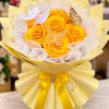 Yellow rose bouquet with butterfly decorations and a satin bow
