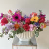Colorful mixed bouquet in a white ribbed vase