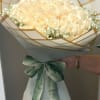 A lush dome of one hundred cream-to-white roses creates an unforgettable birthday