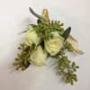 Small white rose boutonniere with green foliage and gold ribbon