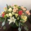 Spray roses, lilies, and hydrangea come together to create this soft expression