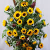 Tall sunflower arrangement with burgundy accents and greenery